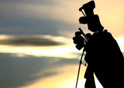 silhouette-of-golf-bag-at-sunset